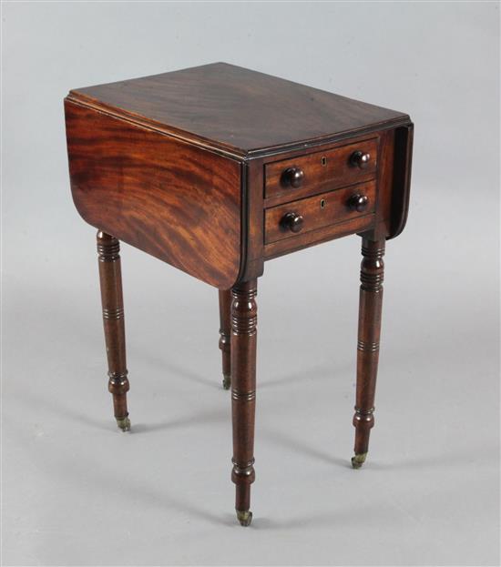 An early Victorian mahogany work table, with double flap top and two end drawers, on turned and tapering legs